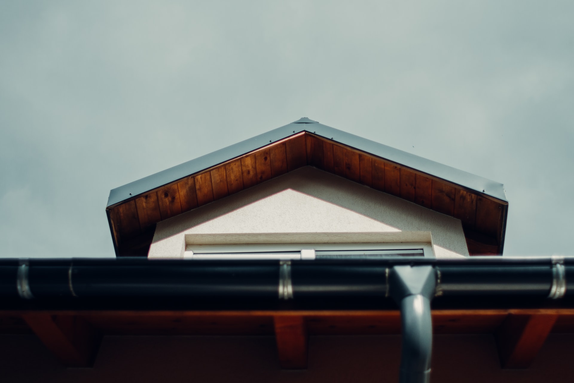 black gutter and brown roof