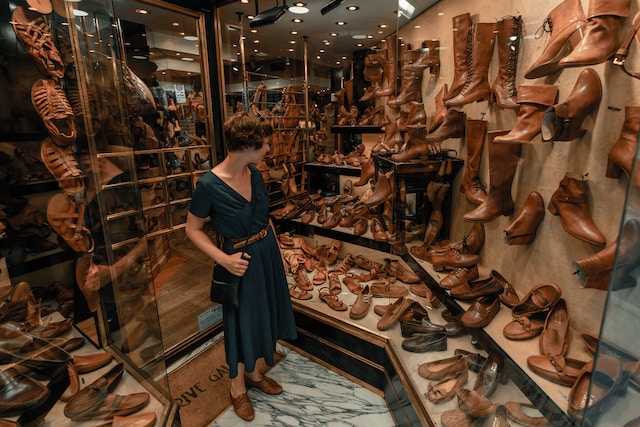 person in shoes shop