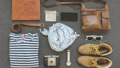 Accessories - Vintage travel essentials flat lay with leather bags, shoes, camera, and clothing.