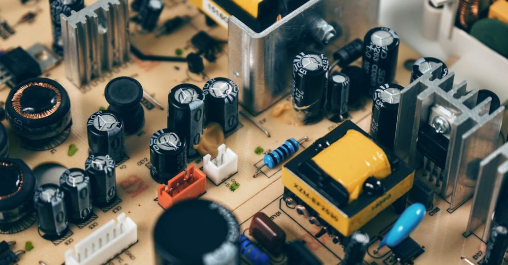 Electronics - Detailed shot of capacitors and resistors on a circuit board, showcasing modern technology.