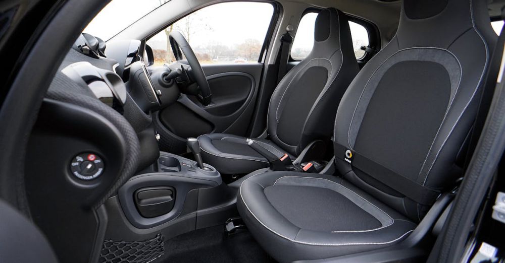 Car Seat - Explore the sleek interior of a modern luxury car featuring leather seats and advanced technology.