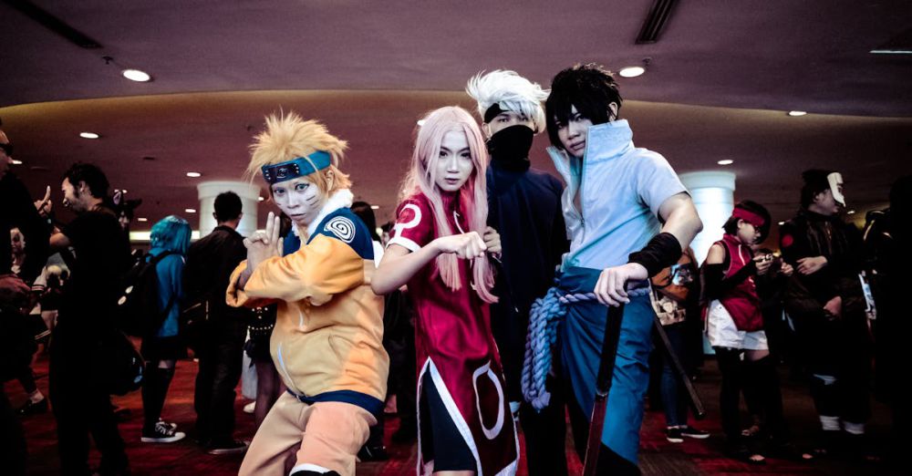 Costumes - A lively group of cosplayers in anime costumes posing at an indoor convention event.