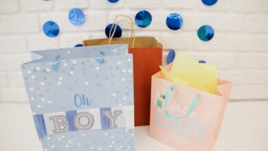 Baby Gifts - Colorful gift bags and decorations for a boy's baby shower celebration.