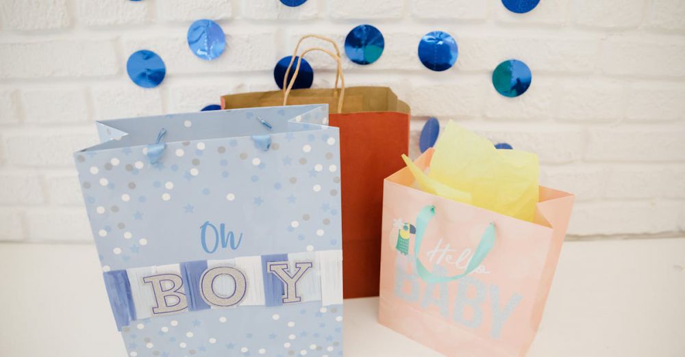 Baby Gifts - Colorful gift bags and decorations for a boy's baby shower celebration.