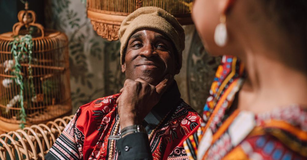 Birdcages - A joyful moment of African American adults in traditional clothes, sharing smiles and happiness.