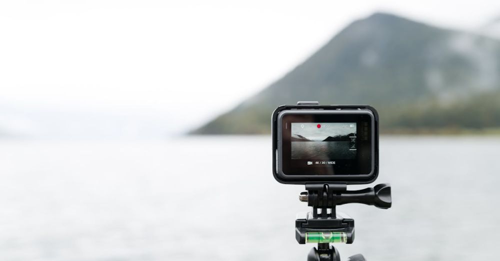 Action Camera - A close-up of an action camera filming a serene lake in Bay of Plenty.