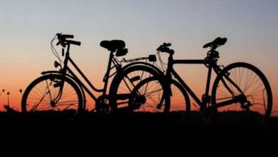 Bicycles - Two bicycles silhouetted against a colorful sunset sky, highlighting outdoor adventure.