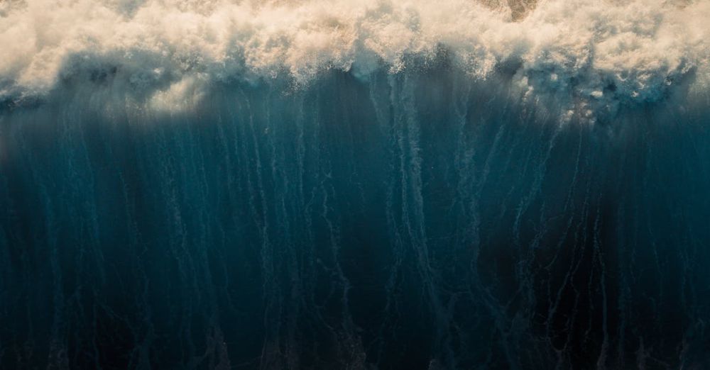 Outdoor Drones - Stunning aerial capture of ocean waves crashing and creating a mesmerizing water pattern.