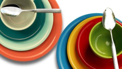 Plates - Brightly colored bowls and plates stacked with spoons, showcasing a vibrant and modern design.