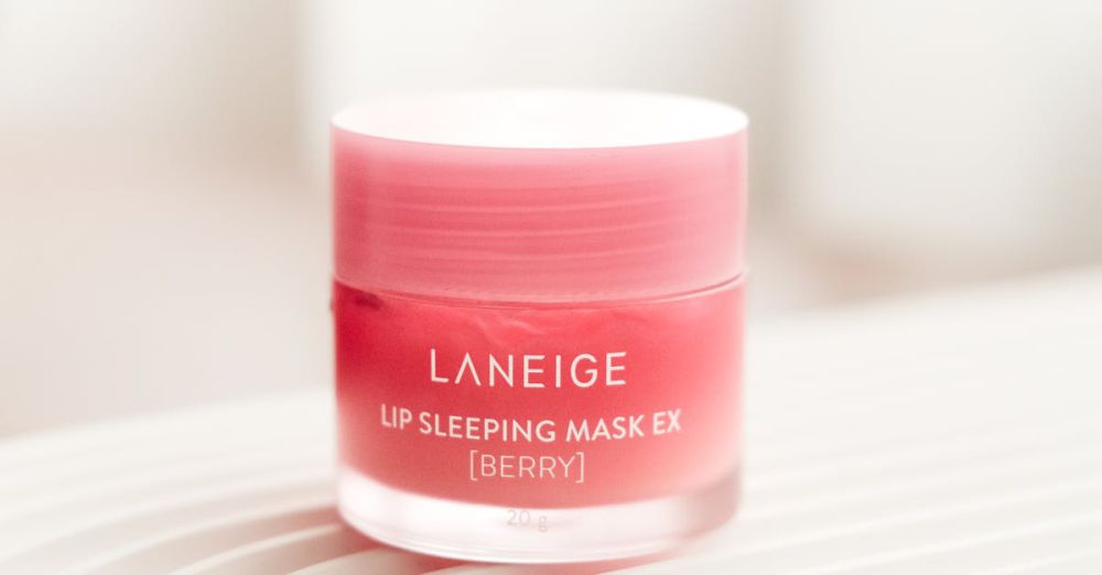 Skincare Routine - Close-up of Laneige Lip Sleeping Mask EX in berry flavor on textured surface. Product photography.