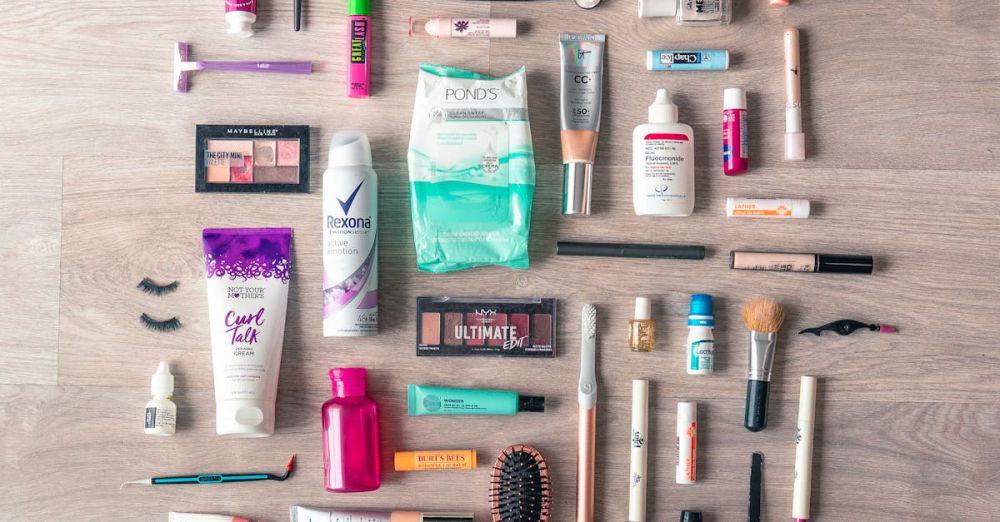 Beauty Products - A diverse collection of beauty and grooming products neatly arranged on a wooden surface in a flatlay style.