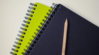 Notebooks - Close-up of spiral-bound notebooks with a pencil, perfect for creative projects.