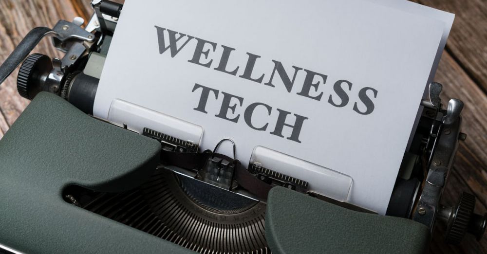 Fitness Trackers - Close-up of a typewriter with paper displaying 'WELLNESS TECH'.