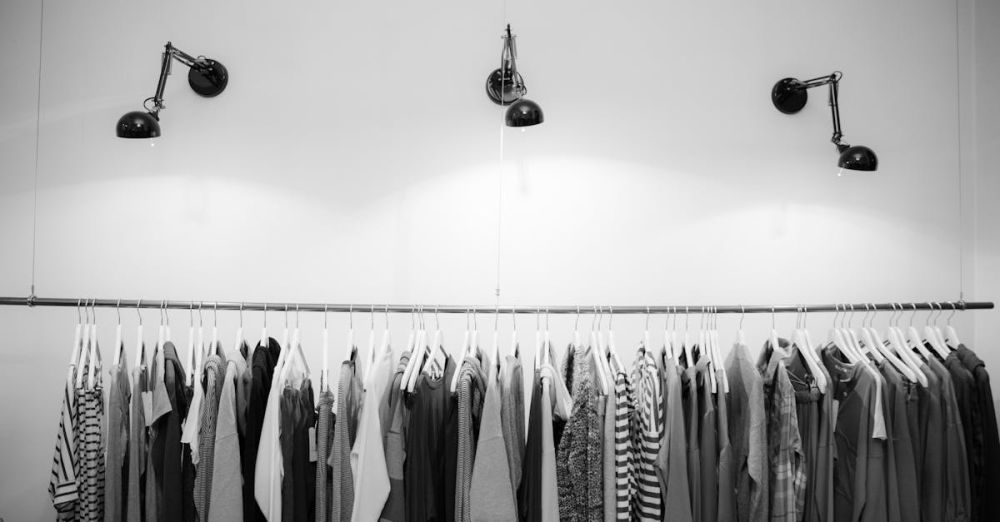 Clothing - Minimalist black and white clothing display in a stylish boutique setting.