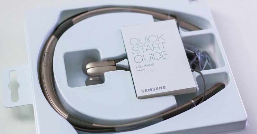 Neckbands - Close-up of Samsung wireless headphones with quick start guide in original packaging.