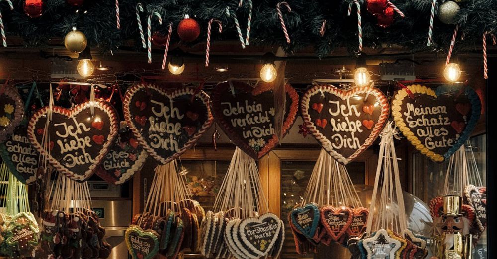 Souvenirs - Festive Christmas market stall in Bayreuth, Germany featuring traditional gingerbread hearts and confectionery.