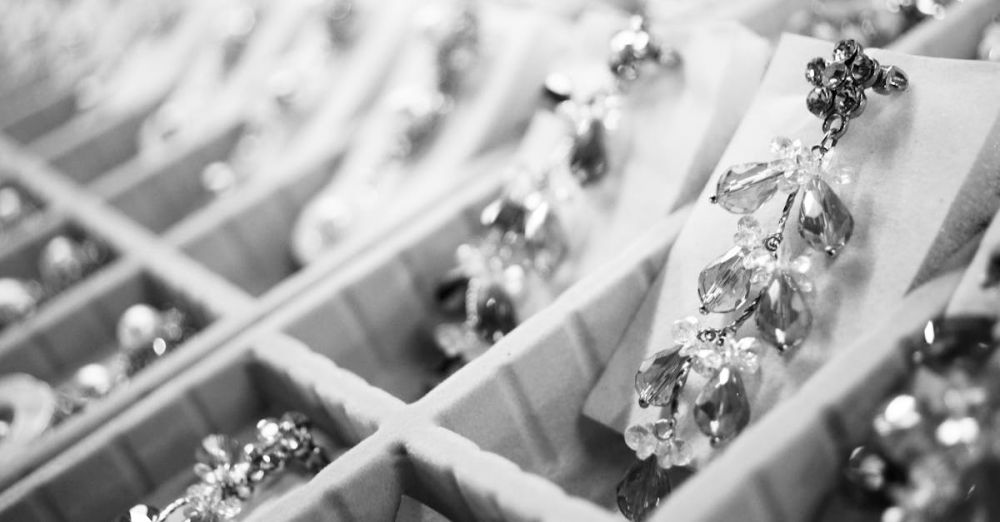 Jewelry - Close-up of elegant crystal earrings in a display box highlighting intricate jewelry details.