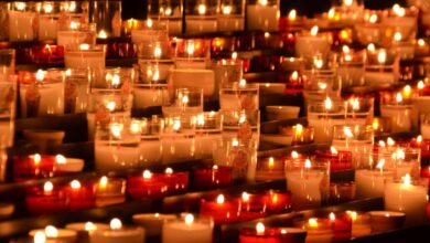 Candles - Rows of flickering candles in a chapel setting, evoking tranquility and reflection.