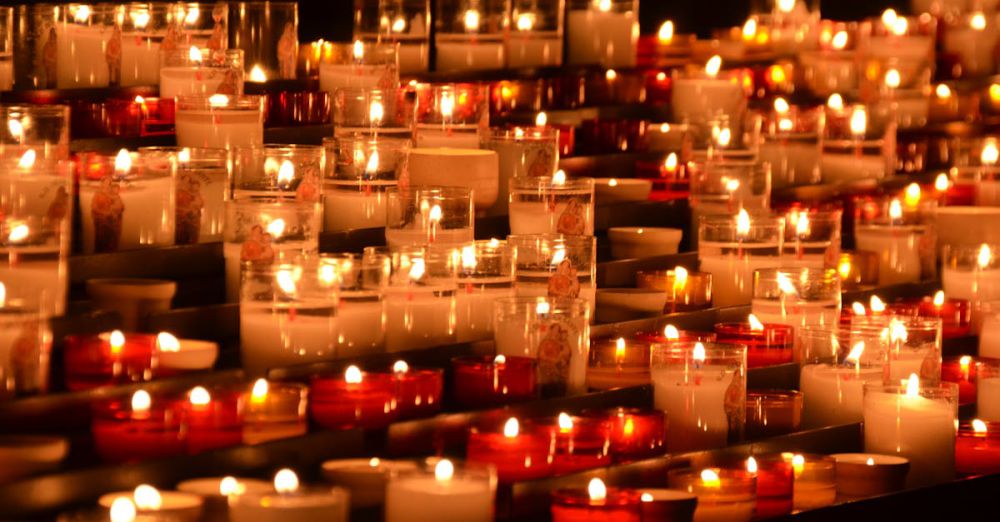 Candles - Rows of flickering candles in a chapel setting, evoking tranquility and reflection.