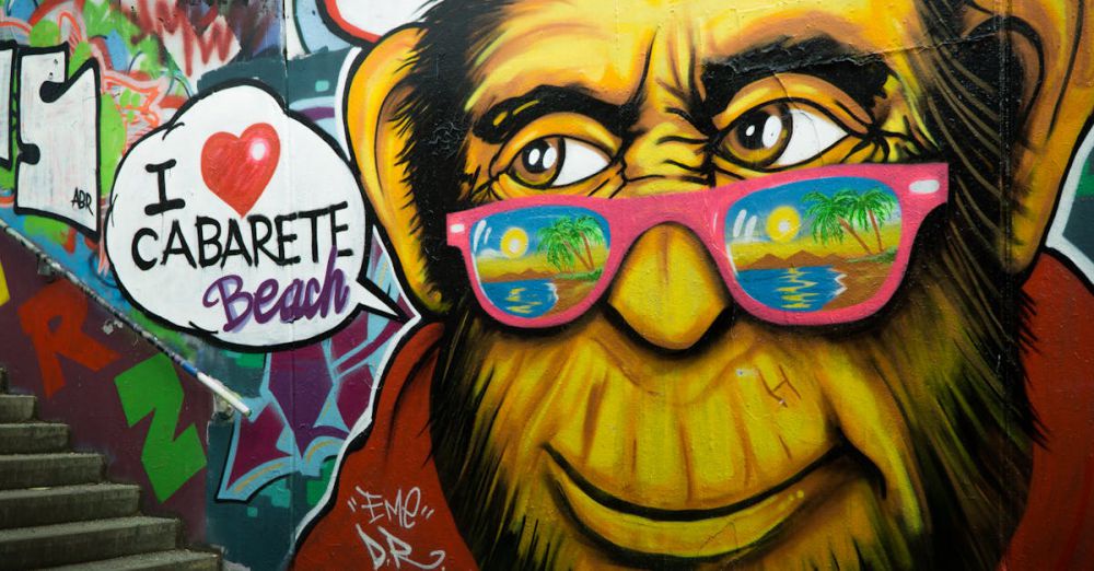 Wall Art - Colorful street art of a monkey with sunglasses on stairs, featuring Cabarete Beach text.