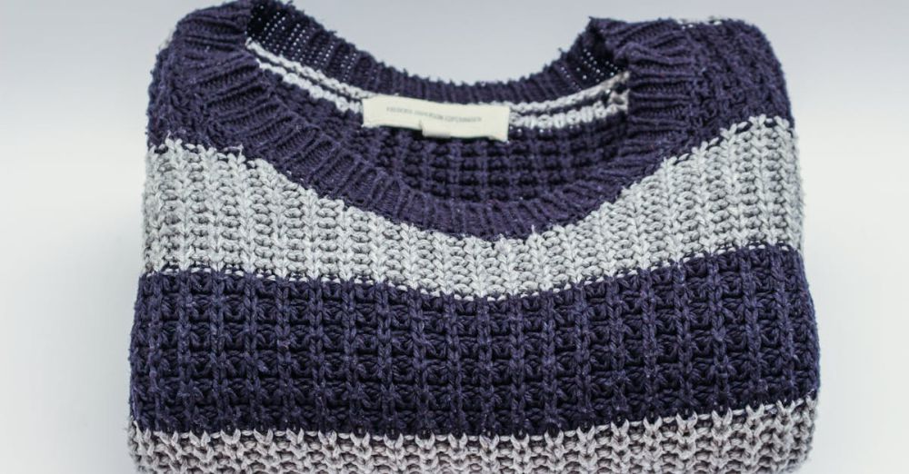 Sweaters - Warm knitted sweater with blue and white stripes, perfect for winter fashion.