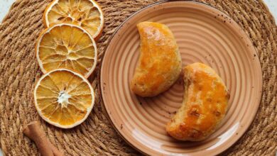 Baking Mats - Tasty pastries on a plate with dried orange slices and cinnamon sticks for a cozy snack setup.