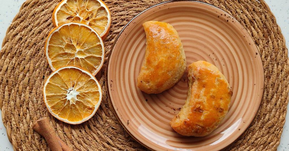 Baking Mats - Tasty pastries on a plate with dried orange slices and cinnamon sticks for a cozy snack setup.