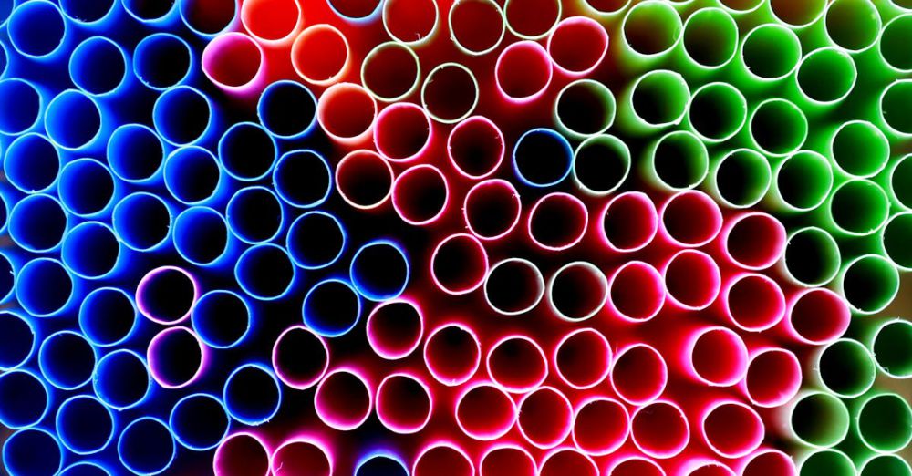 Straws - Close-up view of colorful straws forming an abstract pattern with vivid colors.