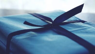 Gift Wrap - A close-up of a beautifully wrapped blue gift box with a ribbon, perfect for special occasions.