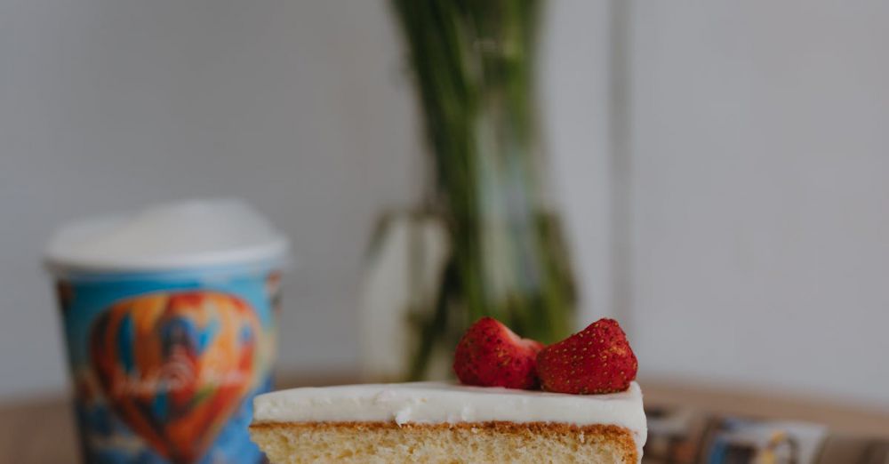 Dish Sponges - A slice of strawberry layered cake on a plate with daisies in the background, ideal for dessert themes.