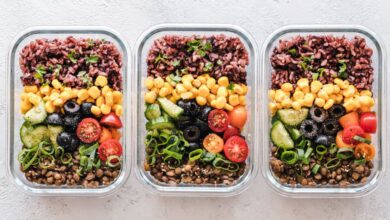 Prep Containers - Colorful healthy meal prep with corn, olives, tomatoes, and lentils in glass containers. Perfect for mindful eating.