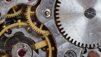 Gear - Detailed close-up of interlocking gears and cogs in a complex mechanical system.