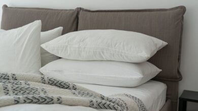 Bed Sheets - Modern bedroom featuring clean white bedding and pillows for a cozy and inviting atmosphere.