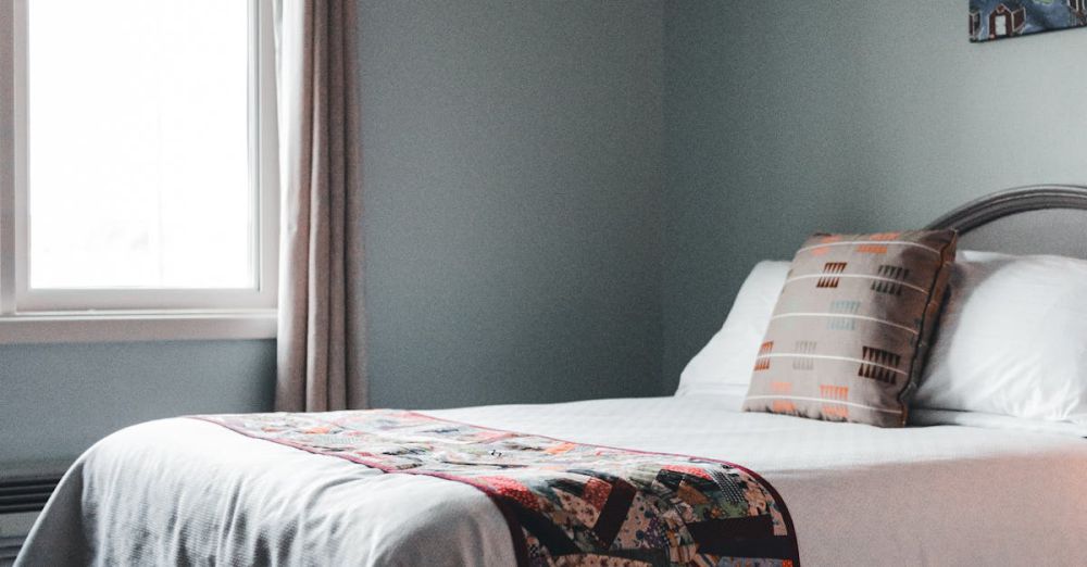 Bed Frames - Inviting bedroom interior featuring twin beds with patterned quilts and soft lighting.