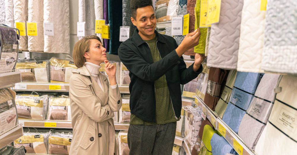 Duvet Covers - Interracial couple selecting bedding in a store aisle.