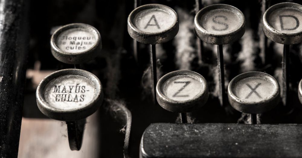 Keyboards - Detailed close-up of vintage typewriter keys showing dust and age.