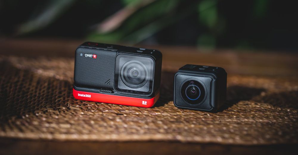 Compact Cameras - Two modular action cameras resting on a wooden table, ideal for tech enthusiasts and content creators.