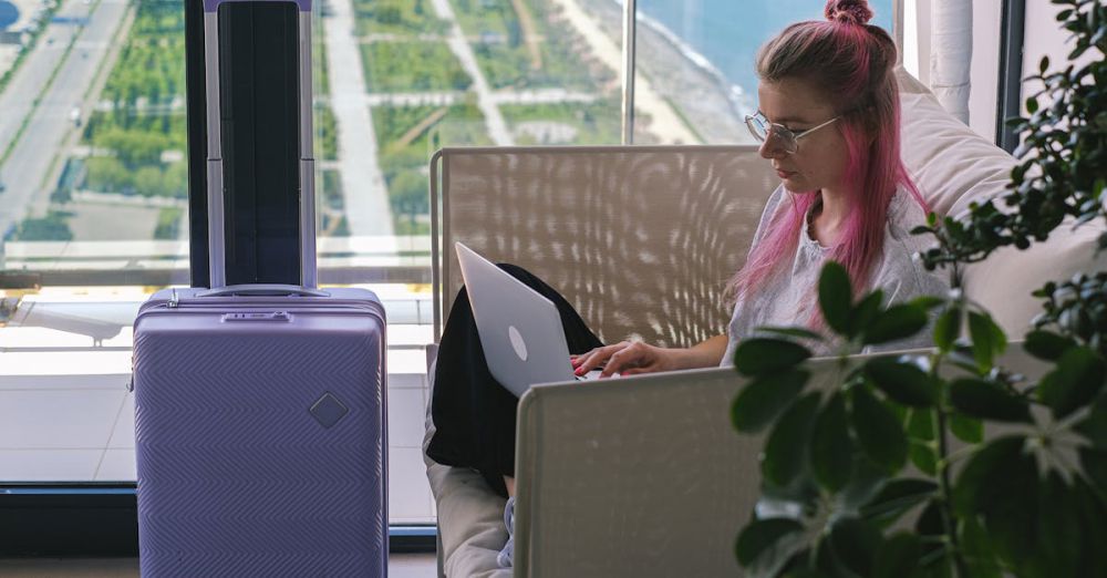 Luggage Trackers - Woman in White and Pink Floral Shirt Using Macbook