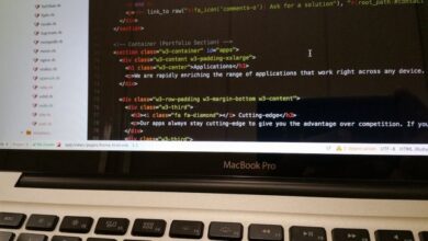 Language Apps - Close-up of HTML code displayed on a MacBook Pro screen, showcasing modern web development.