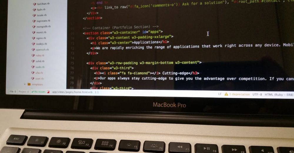 Language Apps - Close-up of HTML code displayed on a MacBook Pro screen, showcasing modern web development.
