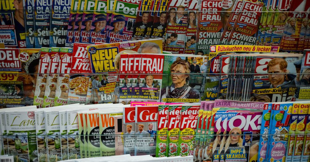 News Subscriptions - A vibrant display of magazines in a newsstand, showcasing various colorful covers and headlines.