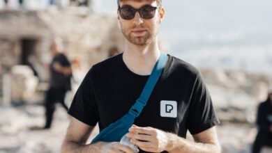 Sports Subscriptions - A man in a black shirt and sunglasses standing on a rock