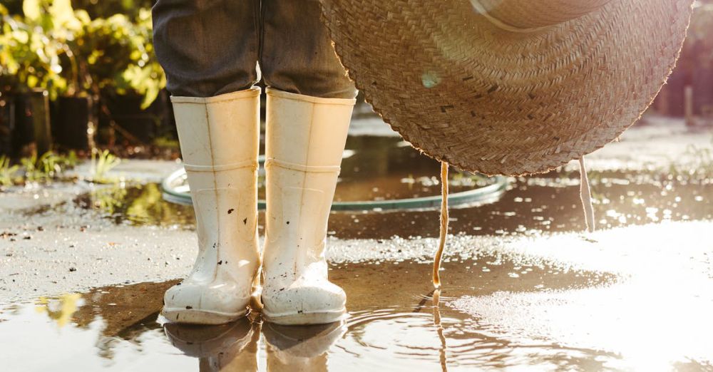 SaaS Tools - A person wearing rubber boots and a hat standing in a puddle