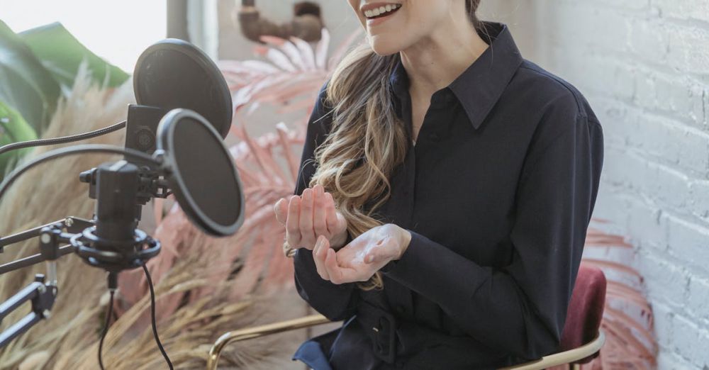 Podcast Platforms - Happy stylish female with long wavy hair smiling and recording with microphone in modern studio