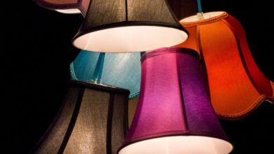 Lamps - A bold display of colorful lampshades creating an artistic light fixture indoors.