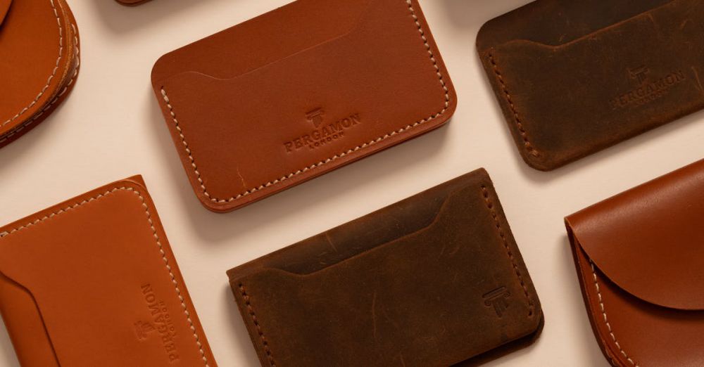 Wallet Cases - Elegant assortment of handcrafted brown leather wallets in a flat lay display.