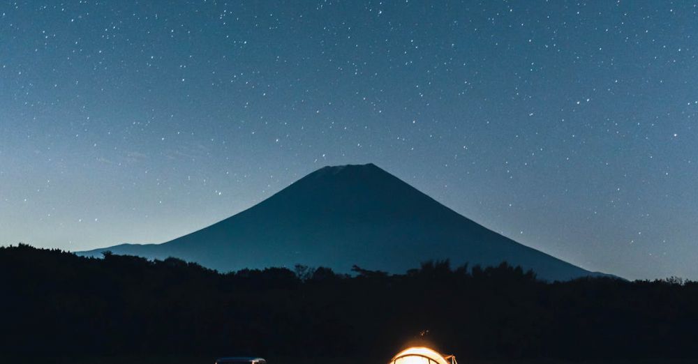 Car Mounts - A serene camping setup under a starry sky with Mount Fuji in the background.