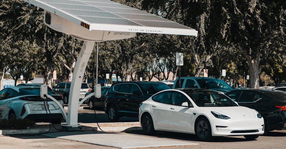 Charging Stations - Electric car parked at a solar charging station outdoors, highlighting renewable energy and innovation.