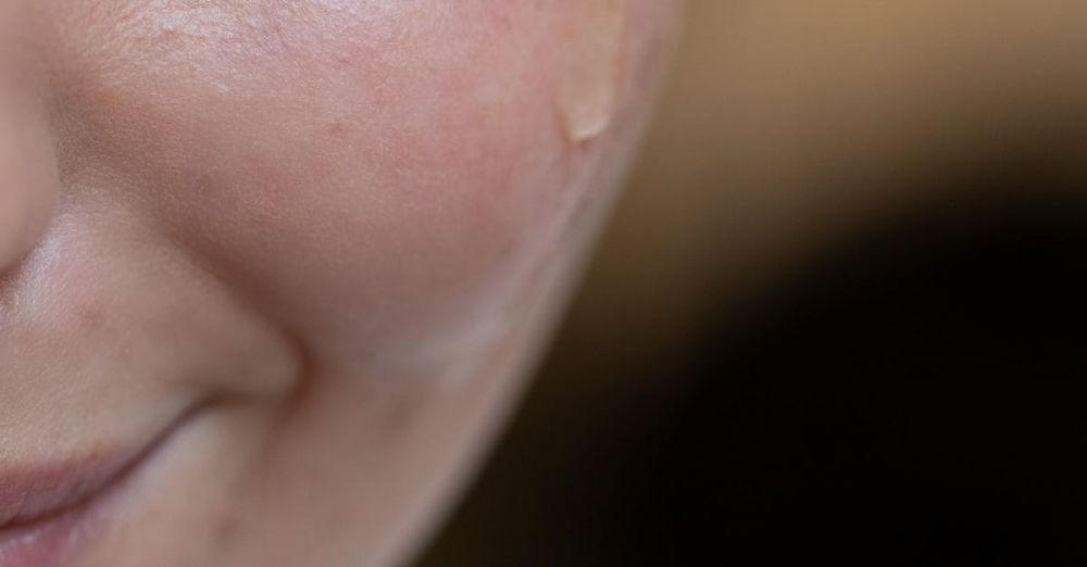 Face Serums - Close-up image of a person applying skincare serum using a dropper.