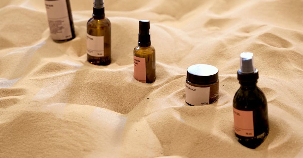 Moisturizers - Explore a unique arrangement of beauty products on a textured sand surface, offering a natural aesthetic.